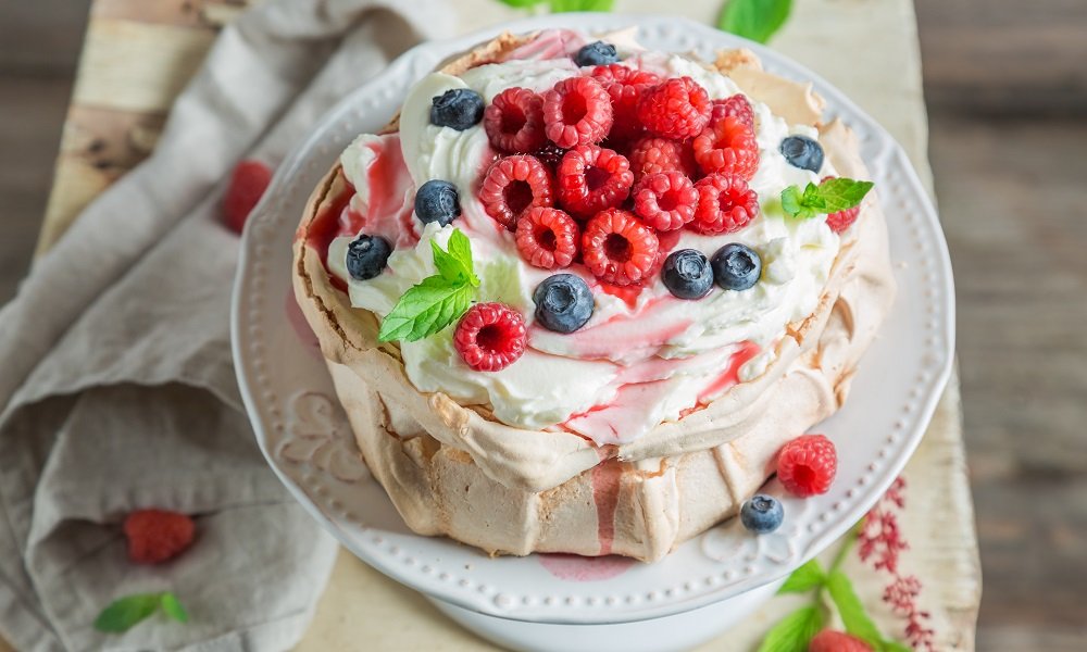 THIS VALENTINE’S DAY DIG INTO A DREAMY PAVLOVA WITH CREAM & BERRIES