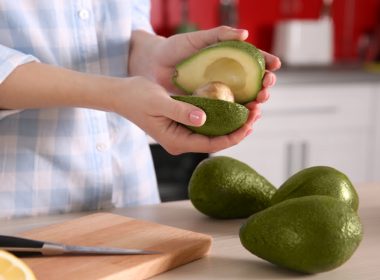 avocados in hand