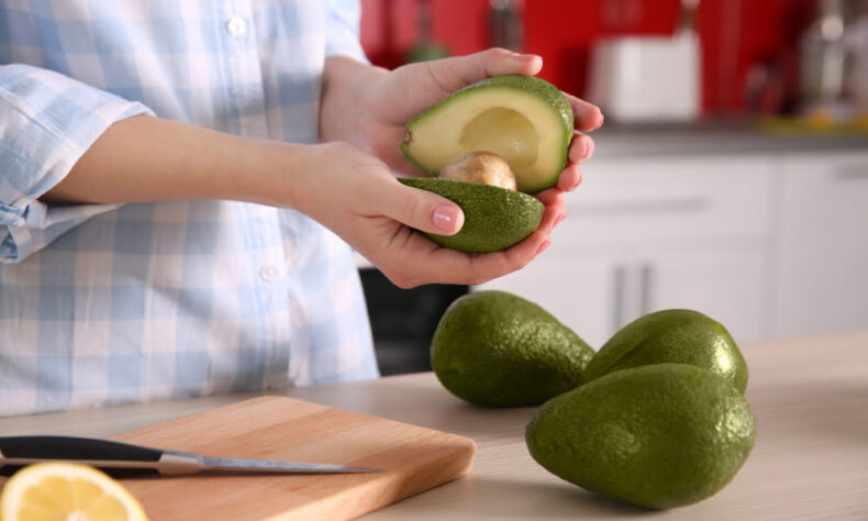 avocados in hand