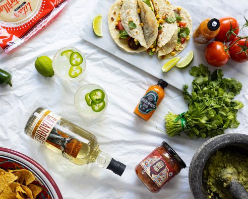 Collection Of Cinco De Mayo Ingredients, Mexican Food, And A Spicy Jalapeño Margarita