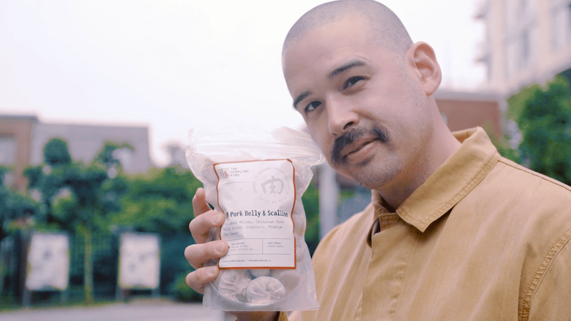 Matt Murtagh-Wu from The Dumpling King with bag of dumplings